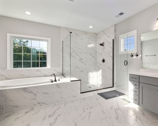 Small marble bathroom with windows