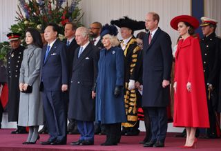 Prince William, Kate Middleton, Queen Camilla, King Charles, First Lady of South Korea, Kim Keon-hee, President of South Korea, Yoon Suk Yeol, standing next to each other