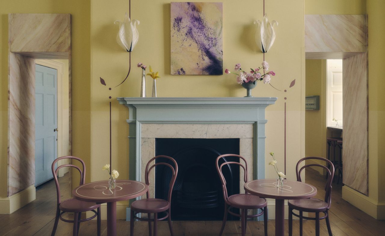 Yellow-accented interior of Café Petiole, London