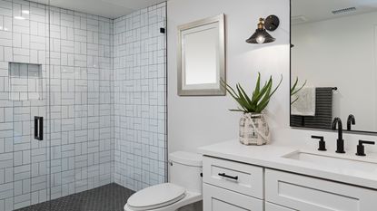 White bathroom with tiled shower