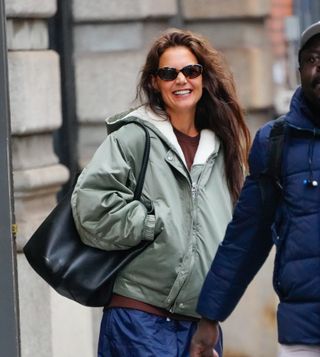 Katie Holmes wears sunglasses and an oversized bag