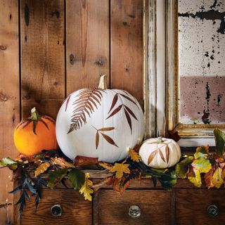 pumpkins decorated with decoupage autumn leaves