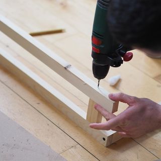 wooden frame with drill machine