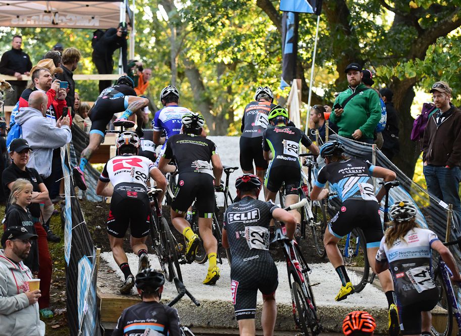 Racers climb on of KMC Fest&rsquo;s infamous carpeted flyovers during the 2015 race