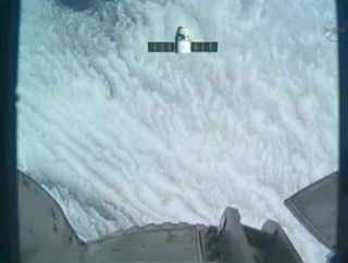 SpaceX's Dragon spacecraft approaches close to the International Space Station in this view from the station's robotic arm camera on Oct. 10, 2012. 
