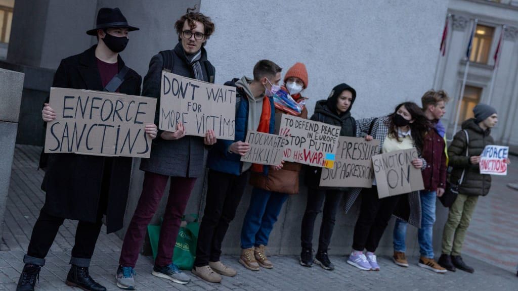 Protesters in Kyiv call for sanctions against Russia.