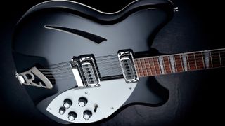 A Rickenbacker 12-string electric guitar on black background