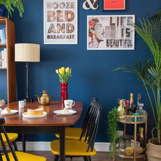 blue indigo wall dinning table with chair and wooden flooring