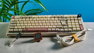 A beige, brown and off-white Epomaker RT100 wireless mechanical keyboard