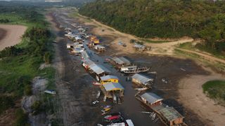 "Traffic jams” of boats and floating houses on the dry bed of Lake Puraquequara, in the outskirts of Manaus.