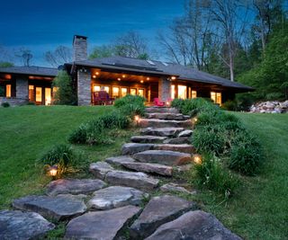 Backside exterior of a Prairie Style house illuminated at night, Farmington, Pennnsylvania, USA