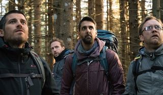 The Ritual Paul Reid Rafe Spall Arsher Ali Sam Troughton see something in the woods that startles th