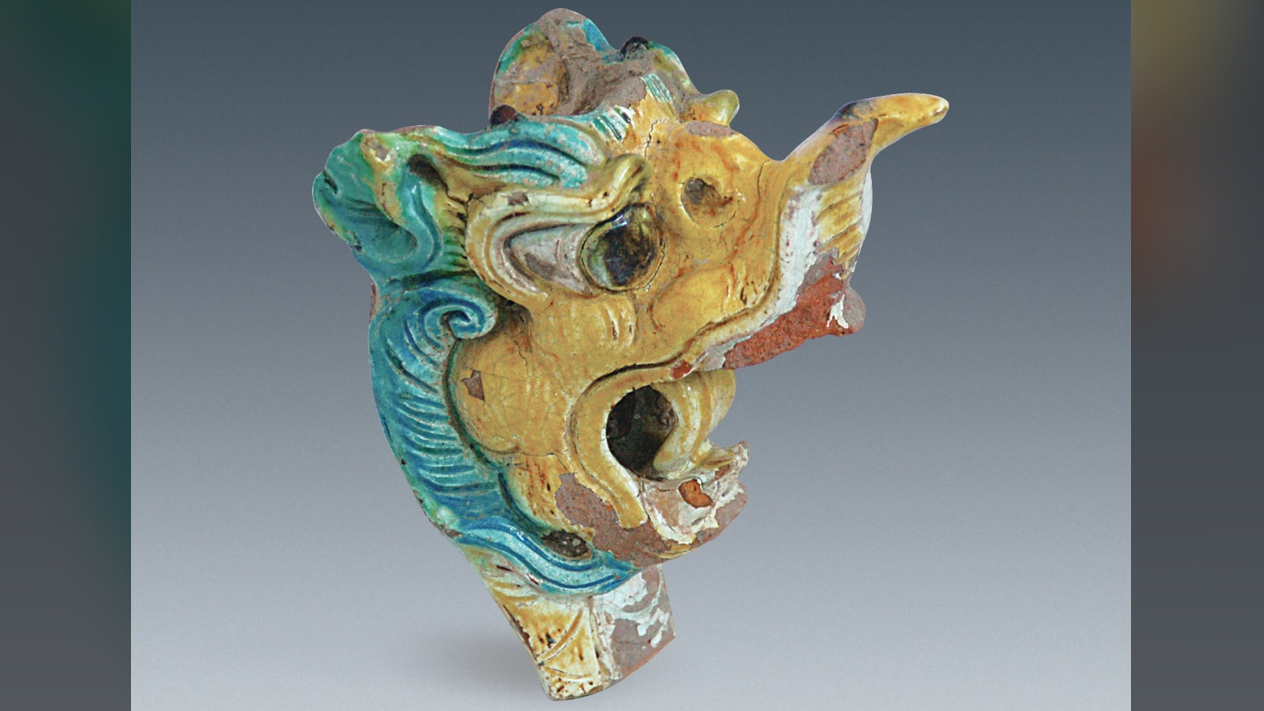 A colorful dragon head found in a palace at Xanadu