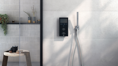 a digital shower system in a modern, light tiled bathroom