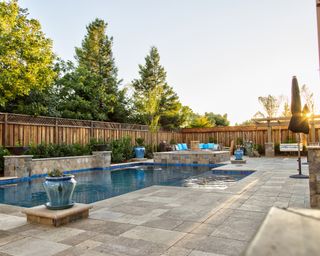 backyard with in-ground pool, hot tub and large patio