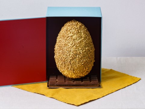 golden chocolate egg in a box