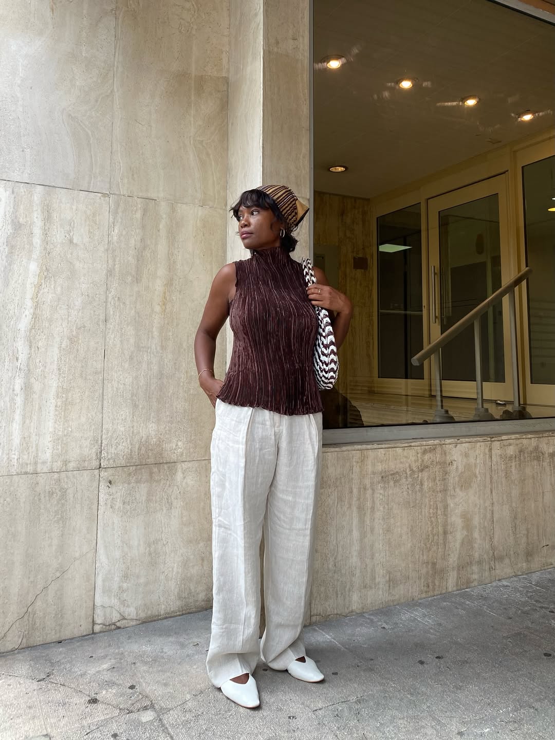 Franny in pleated linen trousers