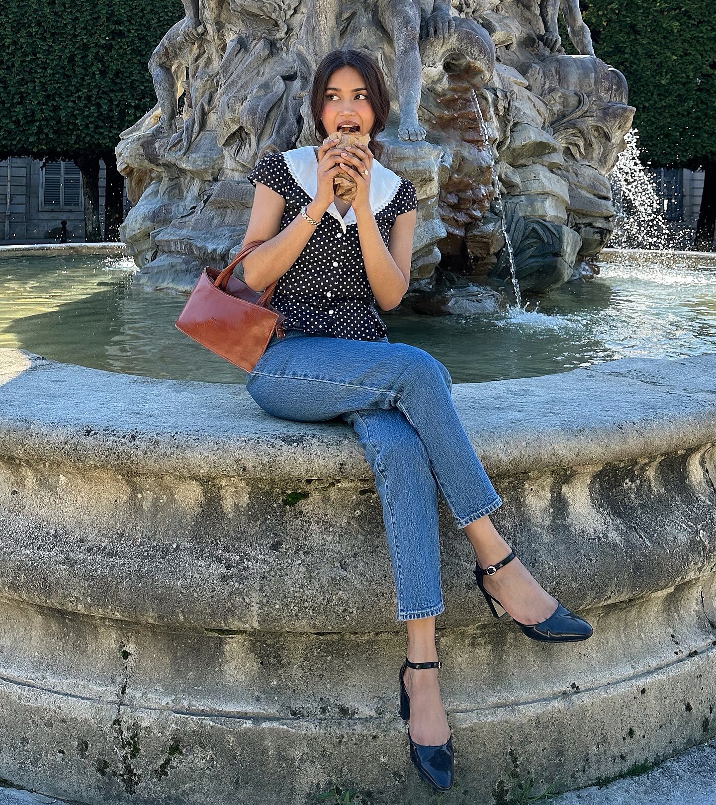 mishti rahman wears a collared blouse, jeans and heels in Paris.