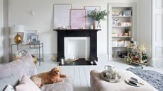 living room with white themed sofa and shelves