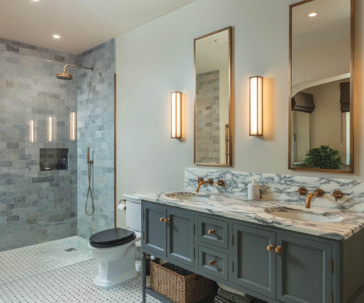Bathroom with his and hers marble sink and grey cabinet underneath