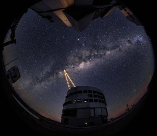 Four bright lasers, the most powerful ever put on a telescope, fire into the night sky to create an artificial guide star for the European Southern Observatory's Very Large Telescope at the Paranal Observatory in Chile on April 28, 2016. The lasers are pa