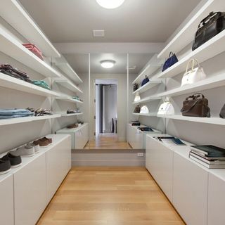 room with wardrobe and wooden floor and shelves