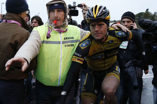 A cold, wet, but happy Gerald Ciolek (MTN-Qhubeka) is shepherded through the crowds after winning the 2013 Milan-San Remo
