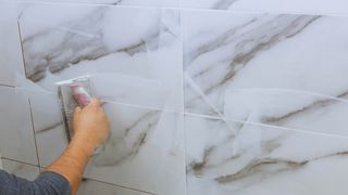 Grouting marble tiles
