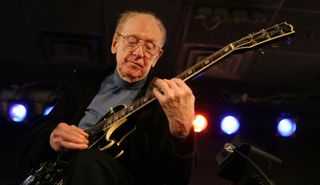 Les Paul performs onstage at the Iridium Jazz Club in New York City on June 4, 2007