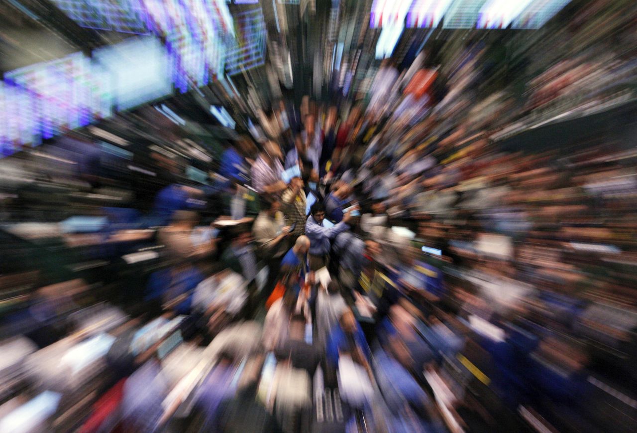 Traders work on the floor of the New York Mercantile Exchange.