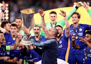 Maurizio Sarri celebrates with the Europa League trophy (PA)
