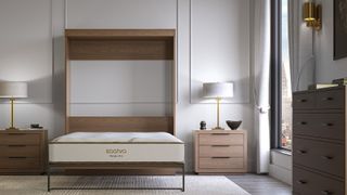 The Saatva Murphy Bed Mattress on a Murphy bed frame lying flat, in a bedroom