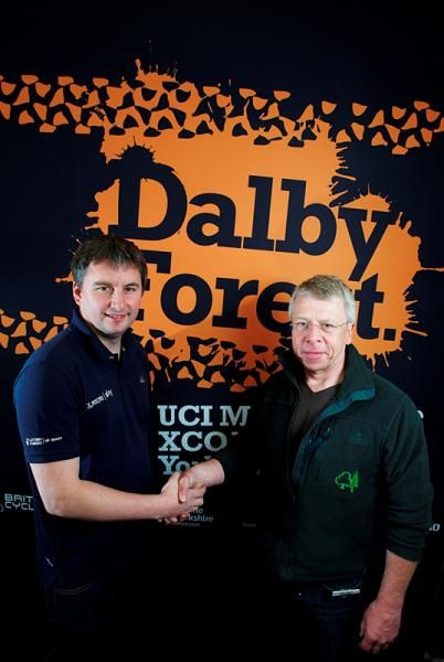 British Cycling&rsquo;s Chief Executive, Ian Drake and Forestry Commission CEO, Simon Hodgson shake hands on the new deal at the 2010 UCI Mountain Bike Cross Country World Cup in Dalby.