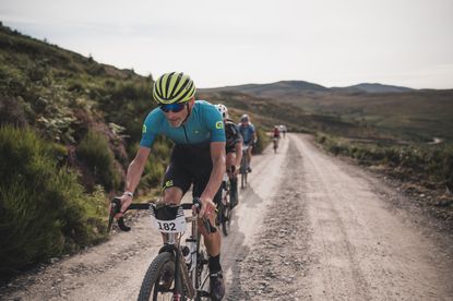 Male riders compete in a gravel race