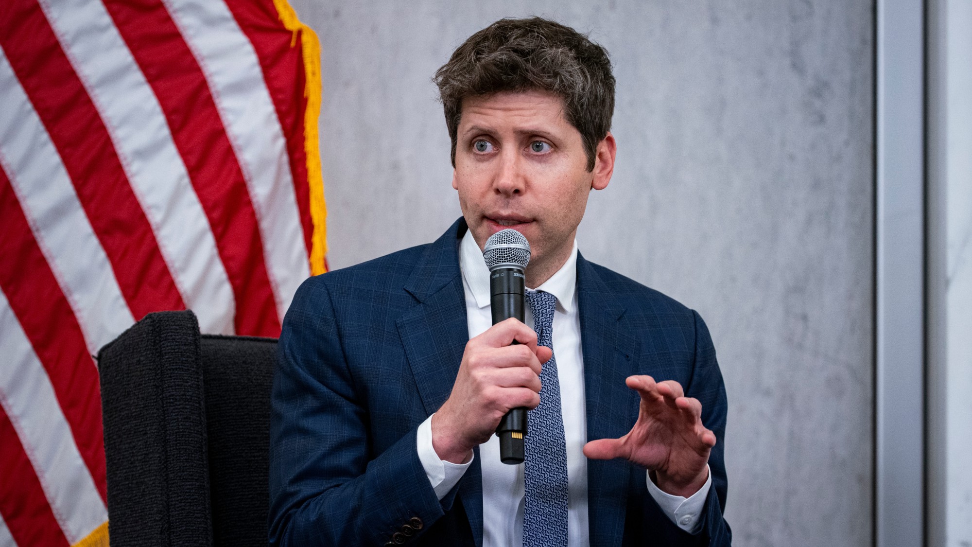 Sam Altman speaking at a conference