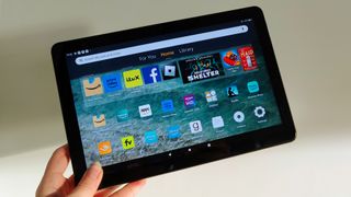 Amazon Fire HD 10 (2023) review: tablet held up against a wall
