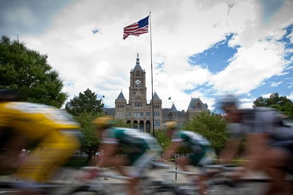 Riders pass by the City and County Building in downtown Salt Lake City.