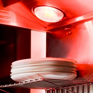red infrared lightning with heat lamp and white plates