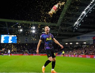 Harry Kane kicks a bottle celebrating his goal