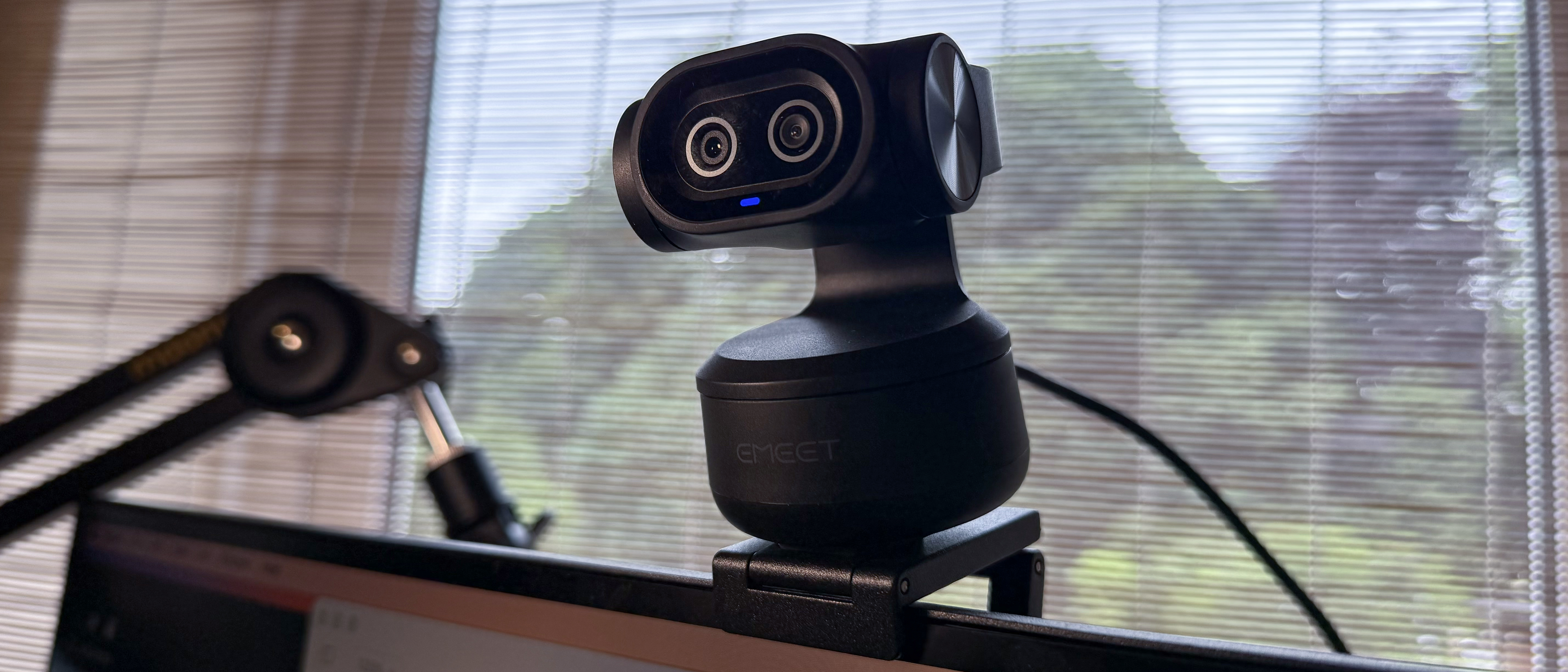 Emeet Pixy Dual-Camera PTZ 4K Webcam on top of a monitor in a 21x9 crop