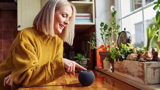 A woman using her Amazon Alexa