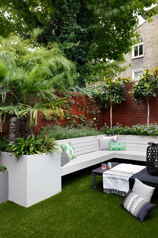 Privacy fence idea with built in banquette and planters