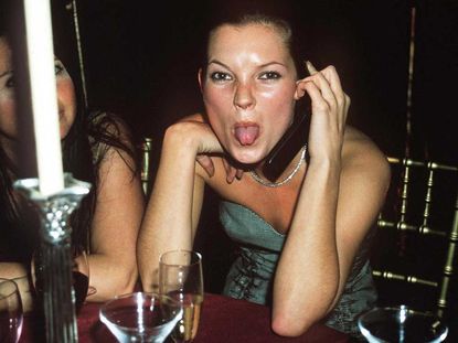 Kate Moss sticking her tongue out