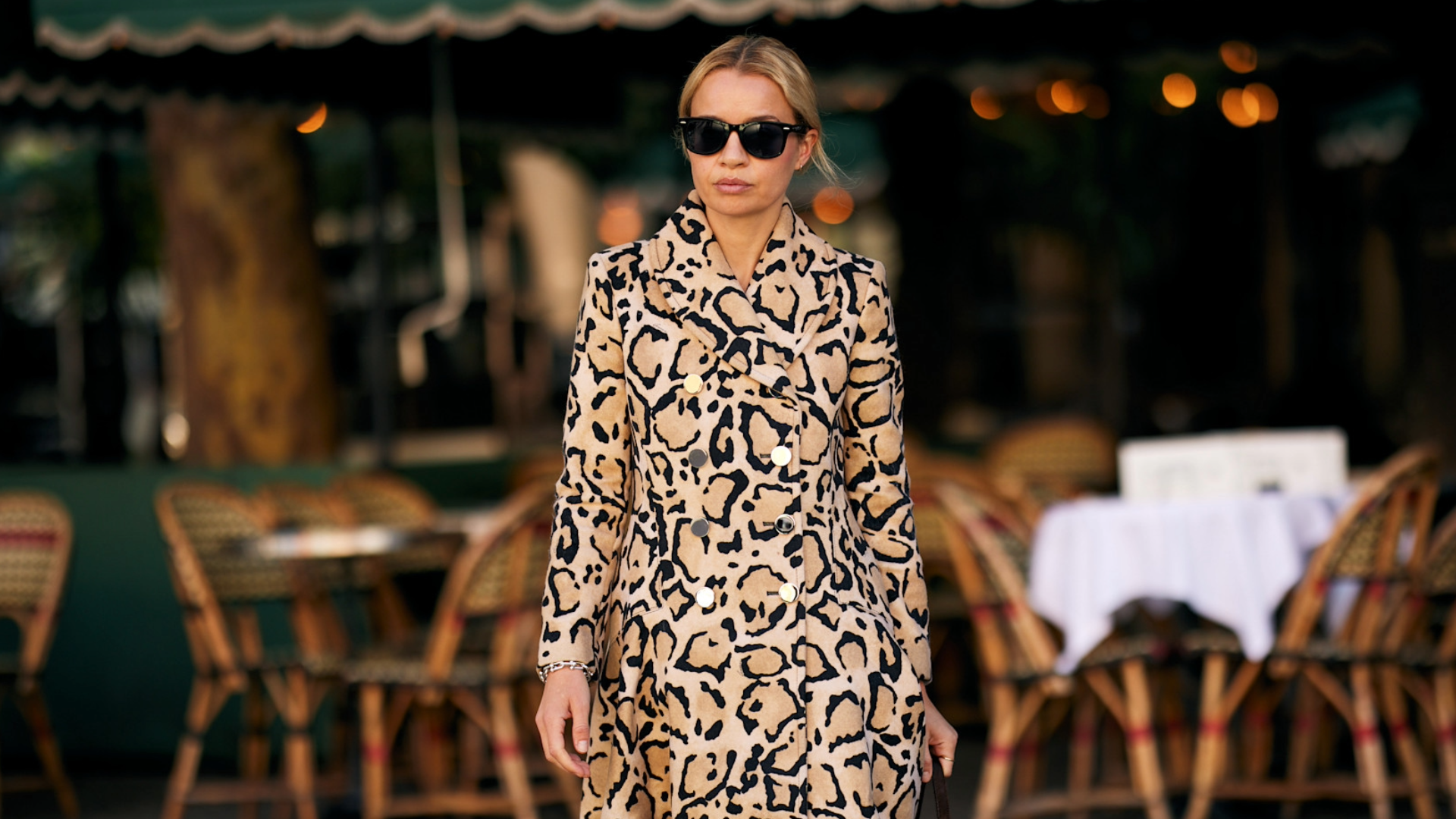 woman wearing leopard print dress and black sunglasses