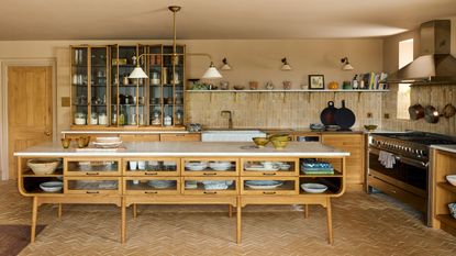 Beige haberdashers kitchen from DeVOL with Bert and May terracotta tiles