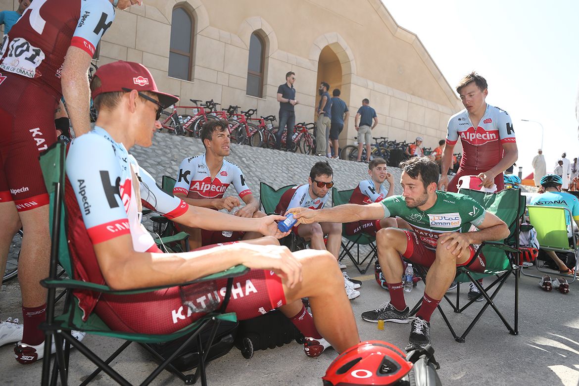With no team buses, riders prepare for the stage out doors