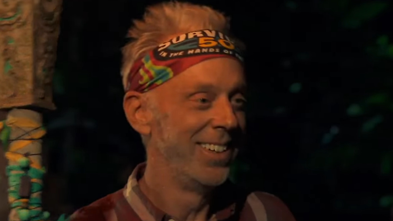 Mike White smiles as he gets his torch snuffed on Survivor.