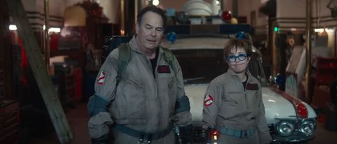 Dan Aykroyd and Annie Potts stand together in uniform in Ghostbusters: Frozen Empire.