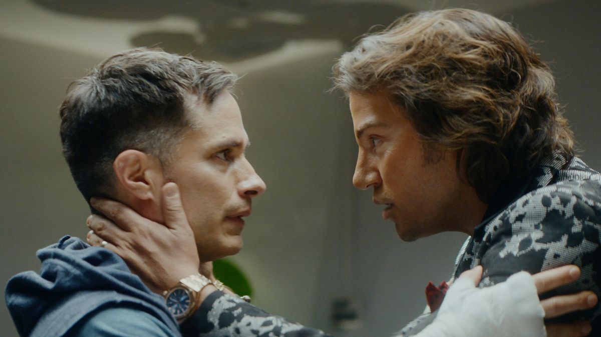 Esteban (Gael Garcia Bernal) and Andy (Diego Luna) (L-R) seen from a side view looking into one another&#039;s eyes in Hulu&#039;s &quot;La Maquina&quot;