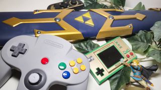 Image of a pile of Legend of Zelda collectibles sitting on a white desk.